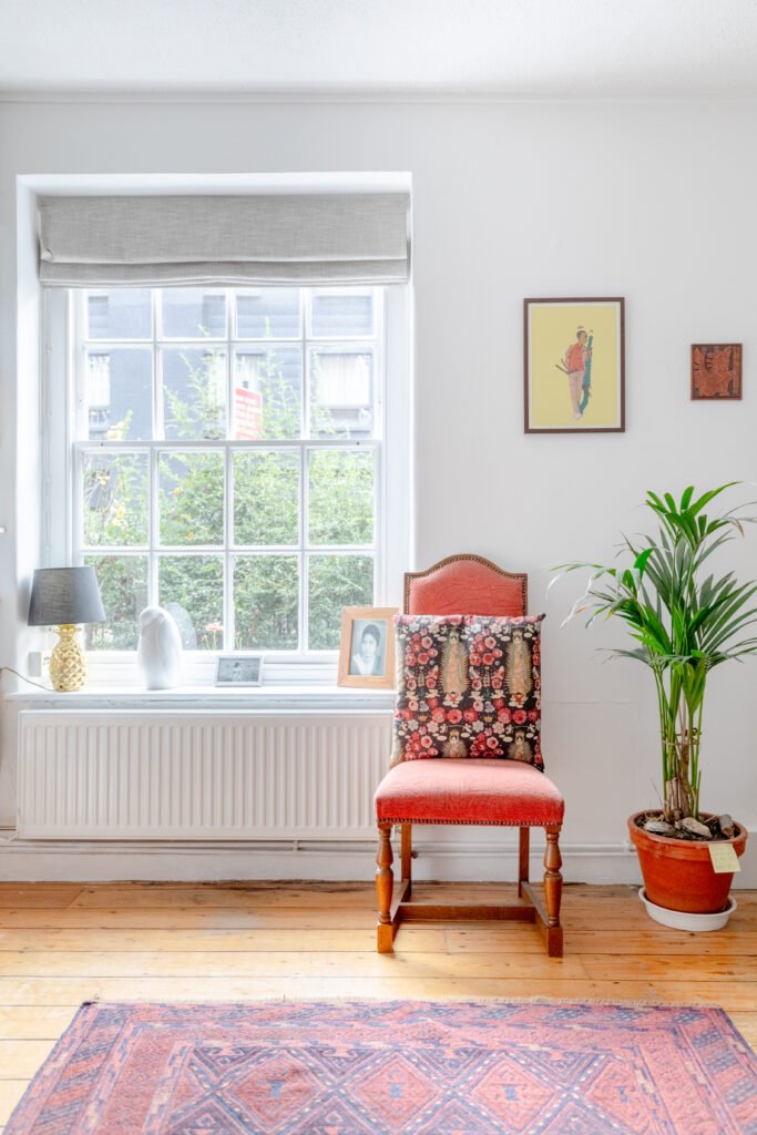 A vintage dining chair in a bright living room